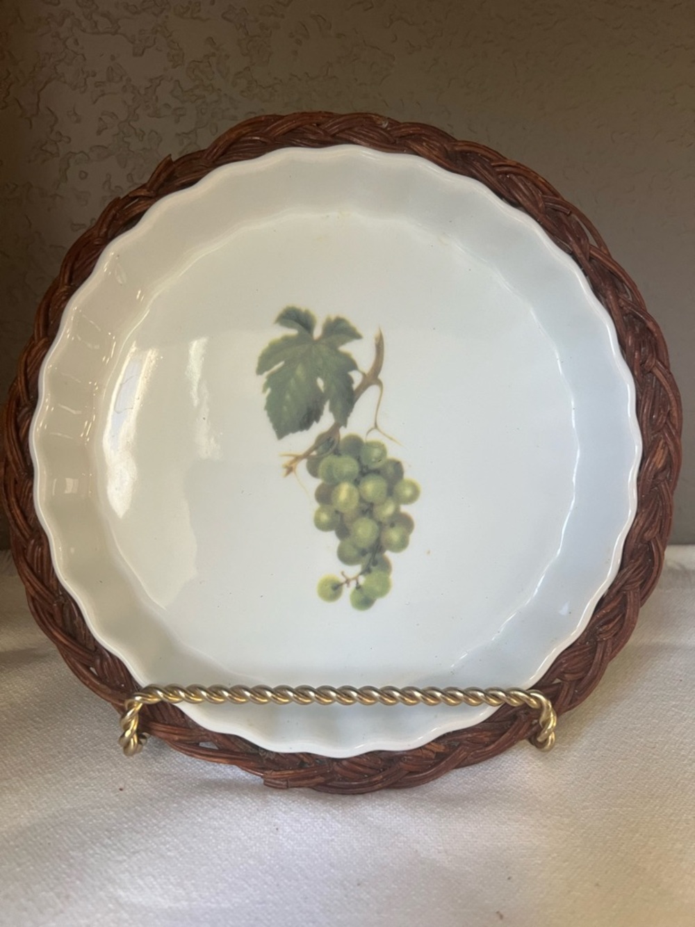 vintage  ceramic quiche dish. fruit motif and a removable wicker basket